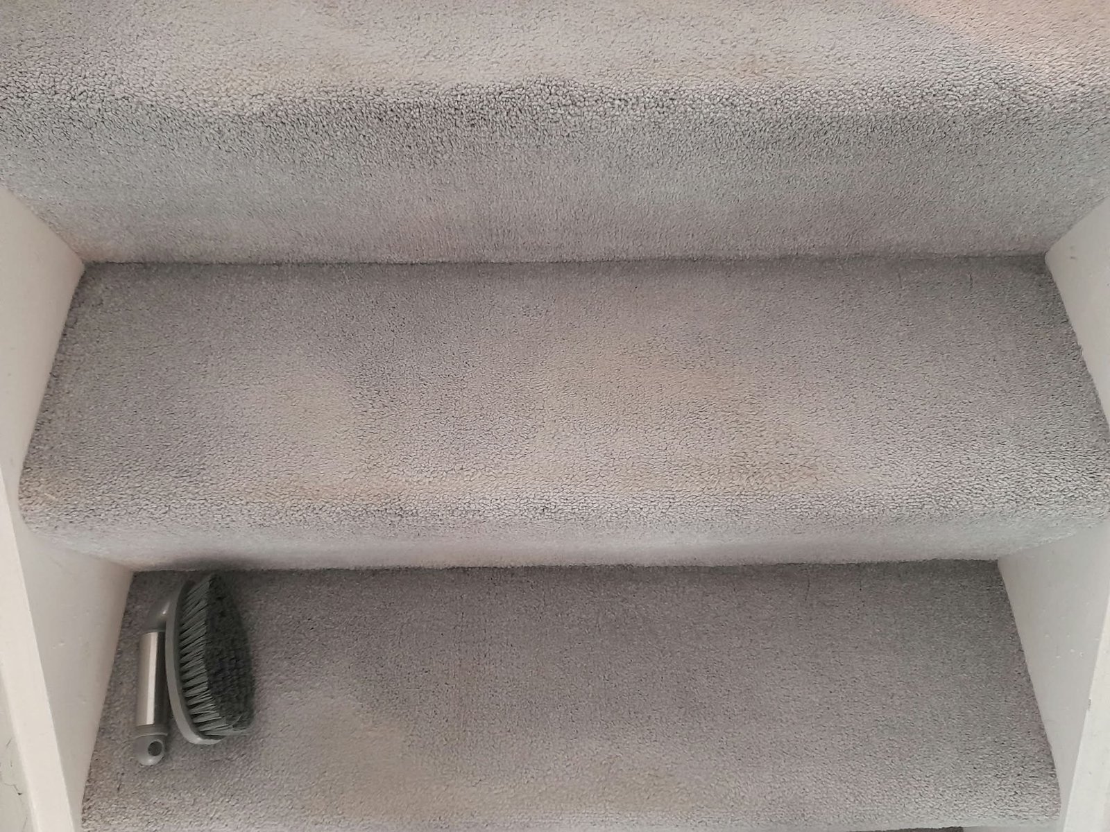 High-traffic staircase carpet after deep extraction cleaning in Surrey